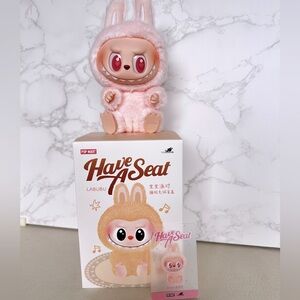 Pop mart Labubu HAVE A SEAT DADA ( pink)